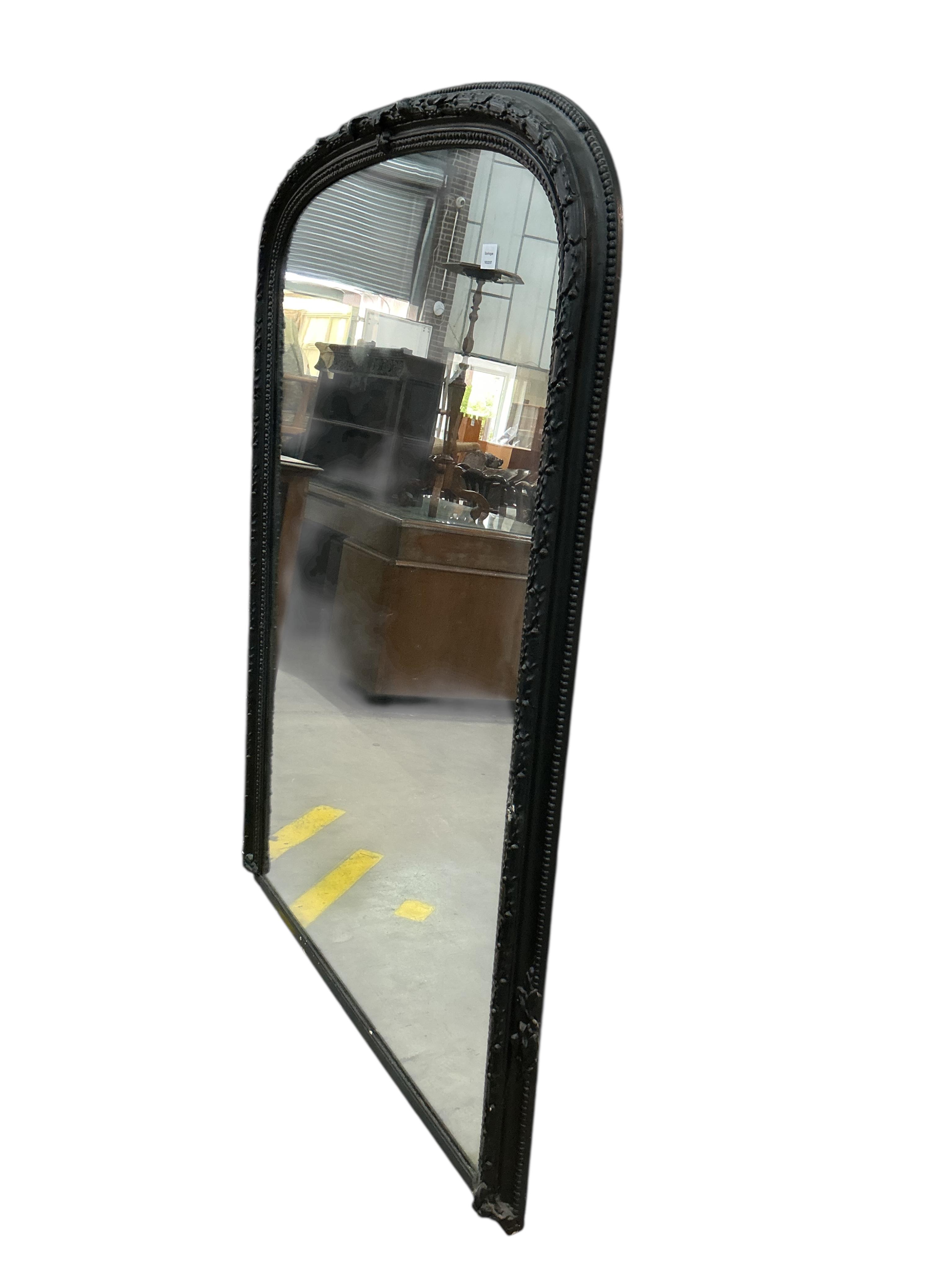 A Victorian overmantel mirror, later painted black, width 122cm, height 165cm